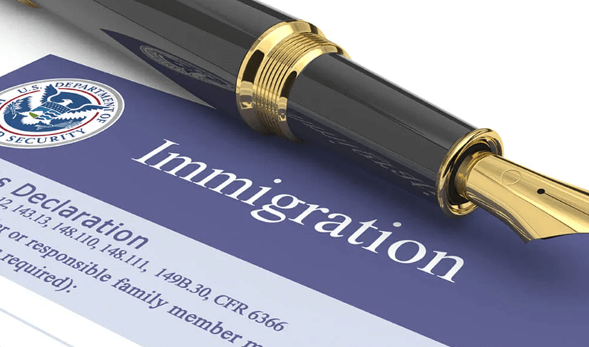 Why-H1B-Visa-Applicants-Should-Consider-the-EB5-Program. We see a pen and a USCIS immigration petition.