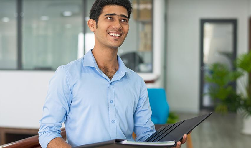 A person holding some documents, ready for the electronic registration process.
