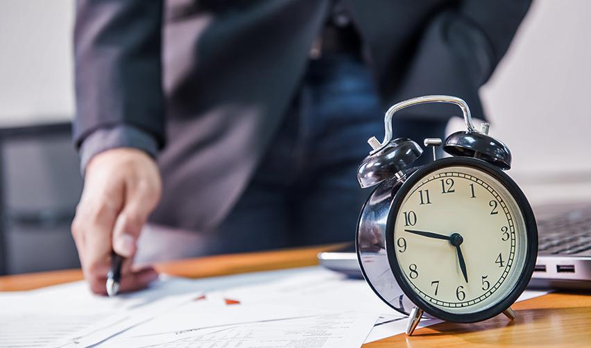 A person examining Eb-5 immigrant investor program documents, calculating investment capital and economic growth.