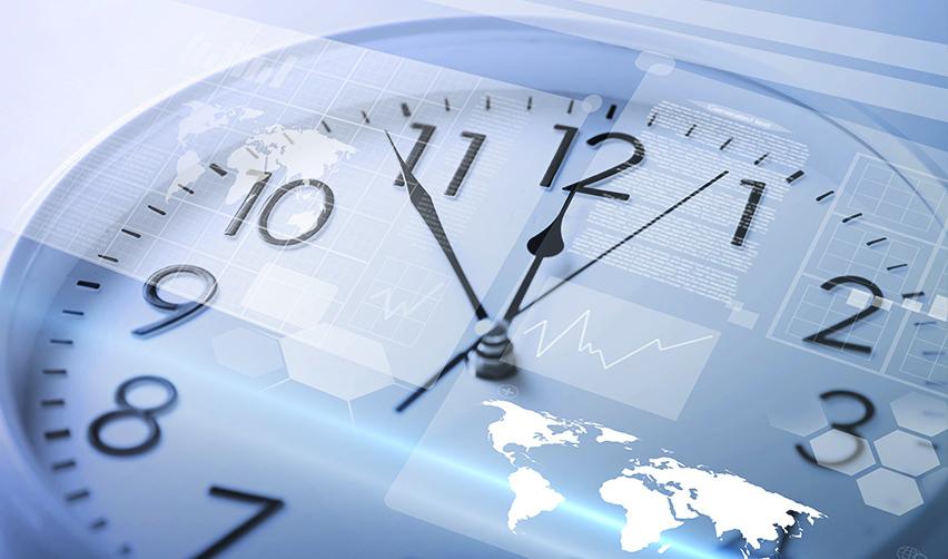 A close-up of a clock with the world map and financial icons inside, symbolizing EB5 for Indian investors.