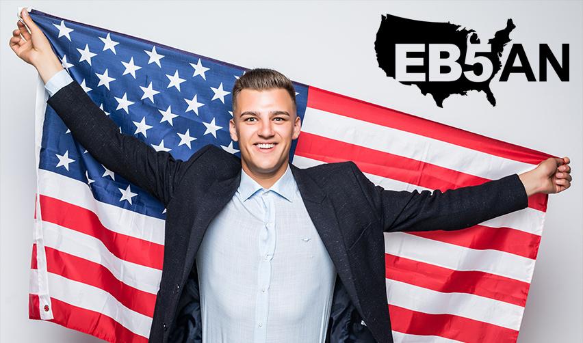 A happy and successful EB5 investor holding the American flag with the EB5AN logo on top.