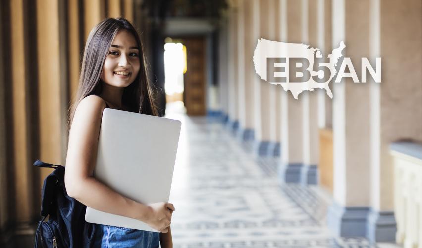 A foreign student visa holder carrying a computer next to the EB5AN logo, symbolizing the change from f1 visa student status to US citizen.