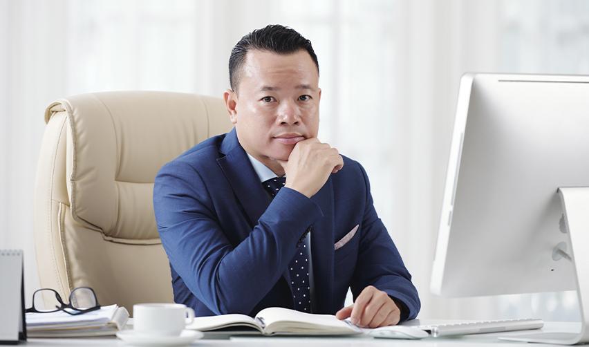 An international student visa holder at an office who plans to change his visa status from an f1 visa to a green card through the EB5 visa.