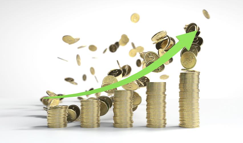 A stack of coins and a green arrow pointing upwards, symbolizing how the EB5 program is promoting economic growth.
