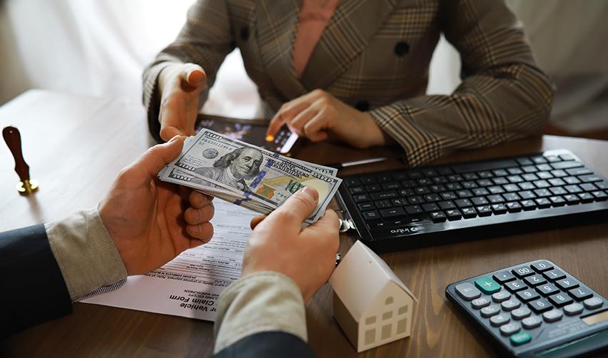 H1b visa holders exchanging some more money at an office regarding a real estate investment.