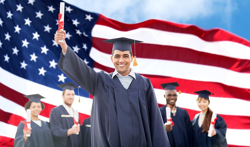 International students who successfully changed their visa status through necessary investment posing in front of an American flag.