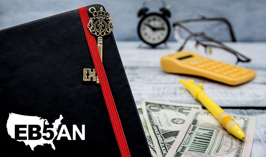 A book with a pocketbook and money and a calculator