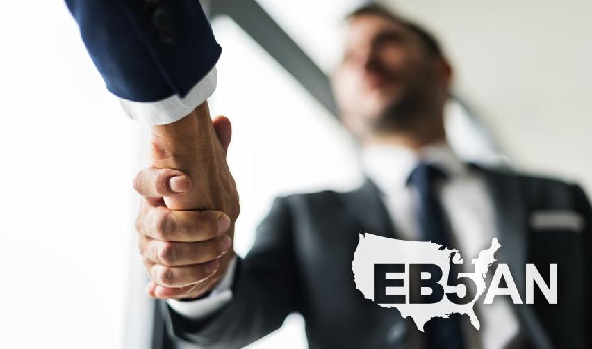 An EB5 regional centers managing partner or immigration service professional shaking hands with visa applicants next to the EB5AN logo.