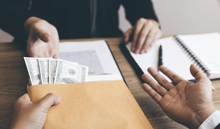 A foreign national getting their EB5 money back in an envelope.