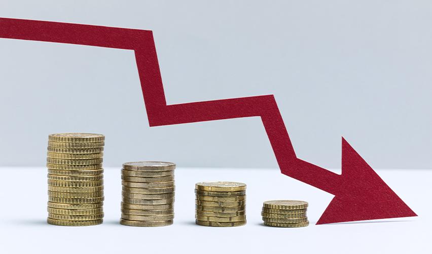 A red arrow pointing down behind stacks of coins.