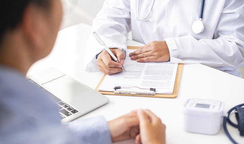 A foreign investor going through the medical exam at a doctor's office.