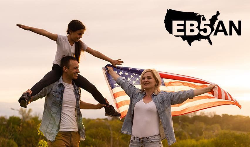 A family of foreign investors celebrating their EB5 Green Card outdoors with U.S. flags, next to the EB5AN logo.