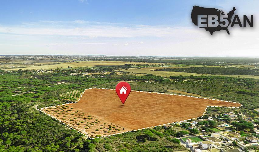 A red pin with a house icon marking a rural plot of land designated for a rural eb5 project, with the EB5AN logo on the corner.