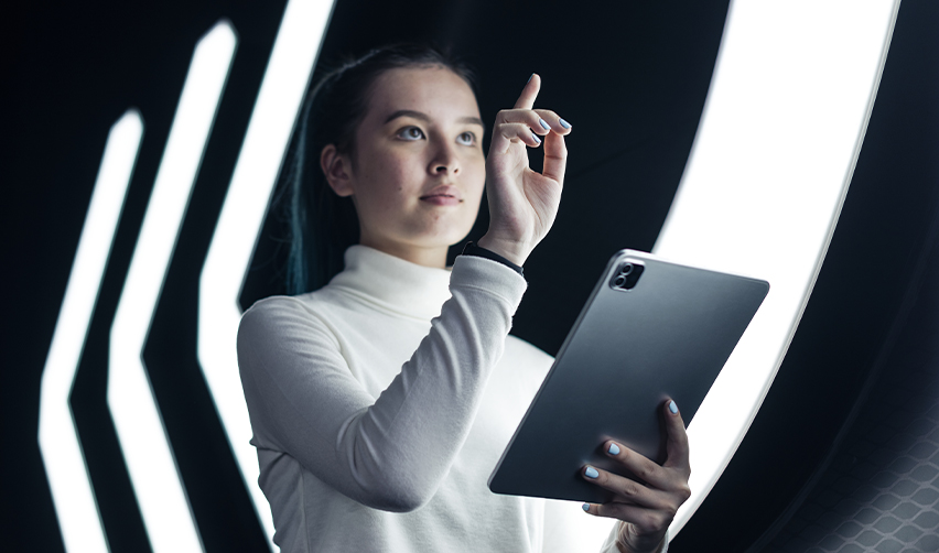 An EB5 investor with a tablet in her hand in a futuristic setting, symbolizing America's future built on innovation.