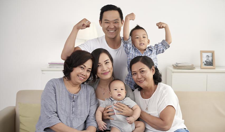 A happy multigenerational family gathered at home, showcasing family-based immigration to the US.