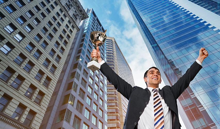 A triumphant businessman holding a trophy amidst a backdrop of urban buildings. This symbolizes achieving US permanent residency through the EB5 program and succeeding in the American business landscape.