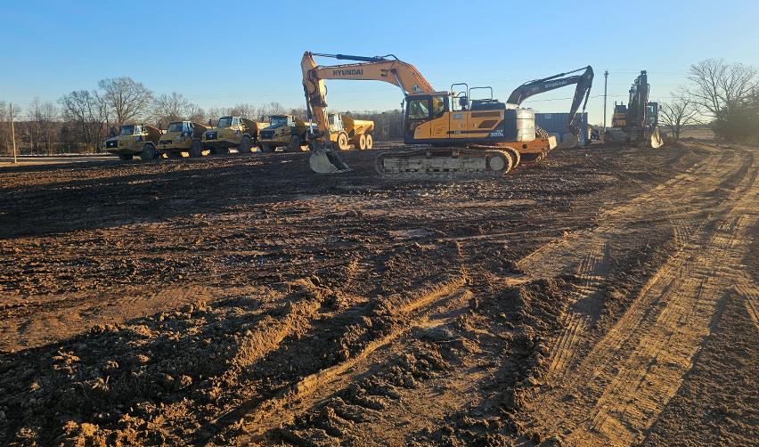 A construction site with excavators and trucks