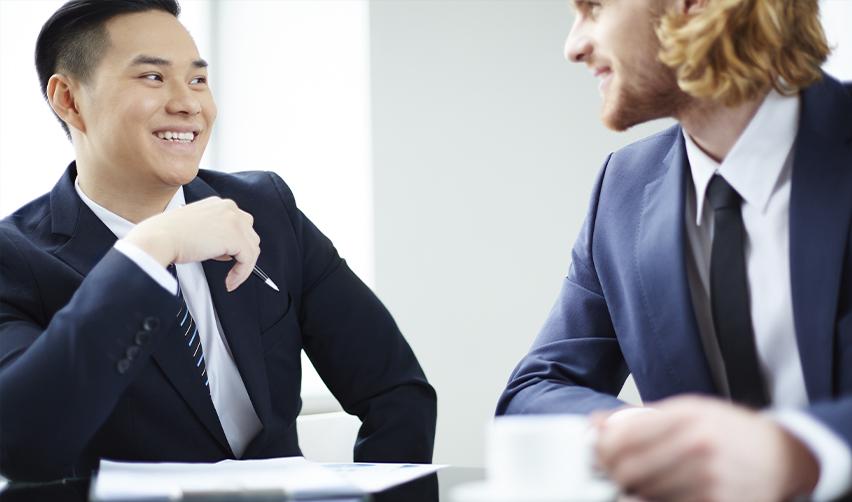 An EB5 investor having a meeting with a regional center professional about adjustment of status processes.