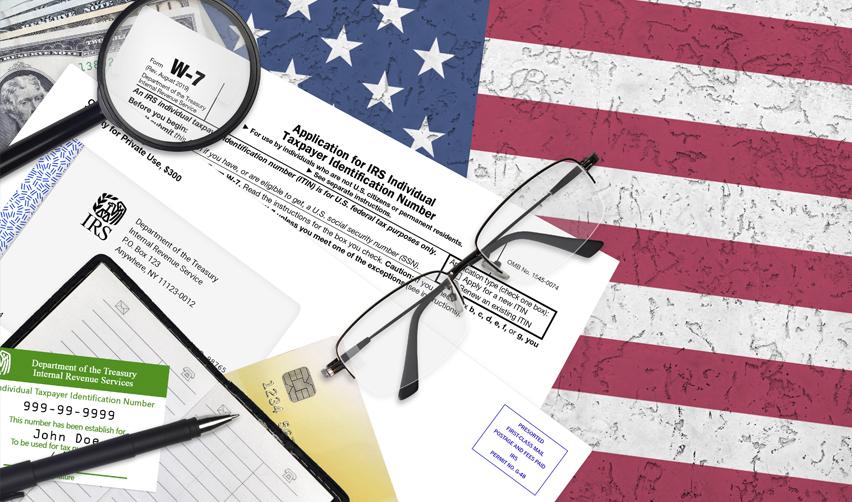 Various financial and tax documents, including an IRS application form and a magnifying glass, overlaid on an American flag background, symbolizing the EB5 source of funds requirement.
