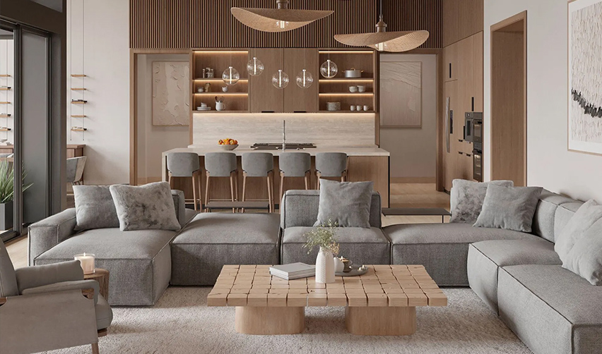 A living room with a large couch and a kitchen