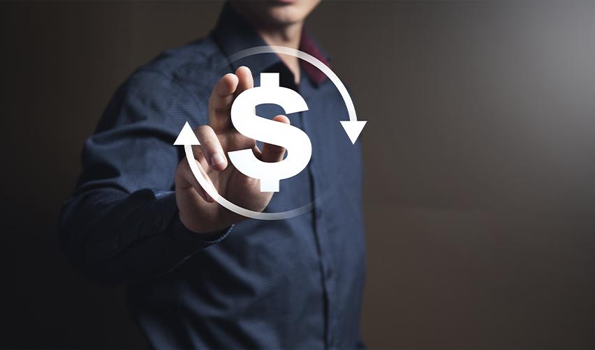 A businessman pointing to a dollar sign with circular arrows, illustrating capital redeployment risks in EB5 investments.