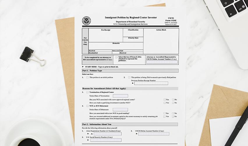 USCIS Form I526E on a desk, representing the EB5 petition filing process concurrently with adjustment of status for Indian investors.