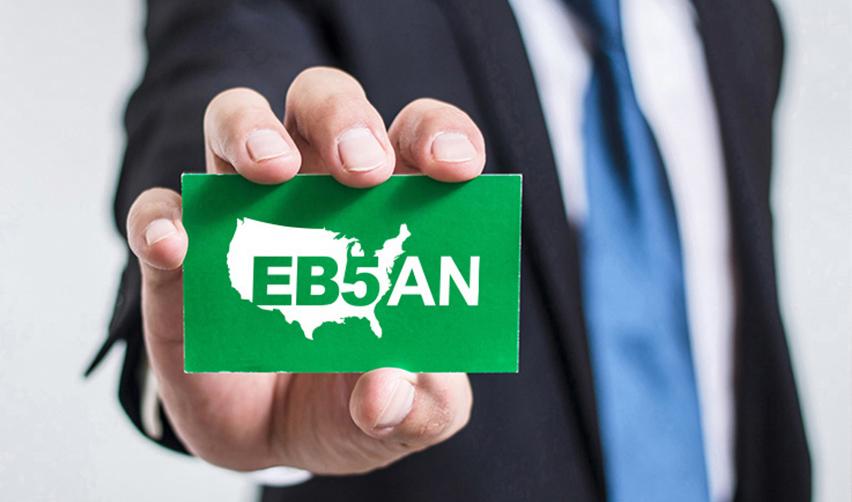 EB5AN EB5 investment green card held by a professional, representing the Twin Lakes EB5 rural project—a prime investment opportunity for foreign nationals seeking U.S. residency.
