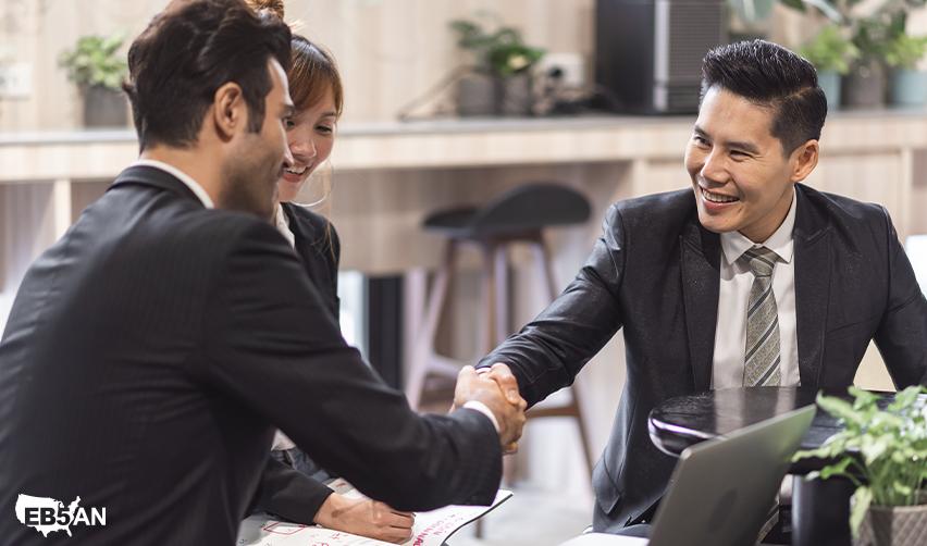 An EB5AN representative shaking hands with an investor, illustrating the value of working with a trusted EB5 partner offering secure and transparent investment opportunities.