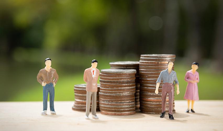Miniature figurines standing by tall stacks of coins, symbolizing pooled capital from multiple investors in EB5 regional center projects, like those of EB5AN.