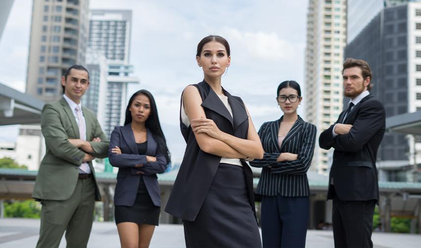 Group of highly skilled professionals in a modern city environment, symbolizing the ambition of global talent seeking U.S. permanent residency through Eb5 or Eb1 visas.