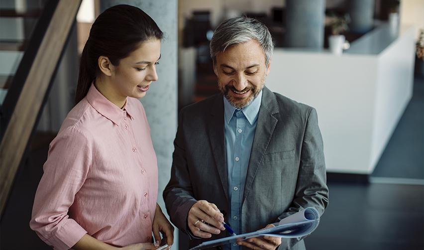 EB5AN investment advisor discussing project details with a client, focusing on job creation and sustainable business models.