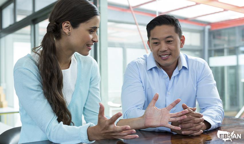 EB5AN advisor discussing the EB5 immigration process with a client, symbolizing expert support for families pursuing U.S. Green Cards through investment.