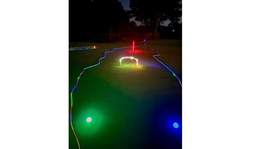A nighttime shot of Bay Creek's Glow Putt event.