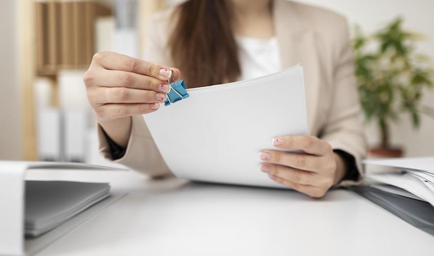 A professional preparing EB5 application documents, reflecting the importance of TEA verification paperwork and investor due diligence.
