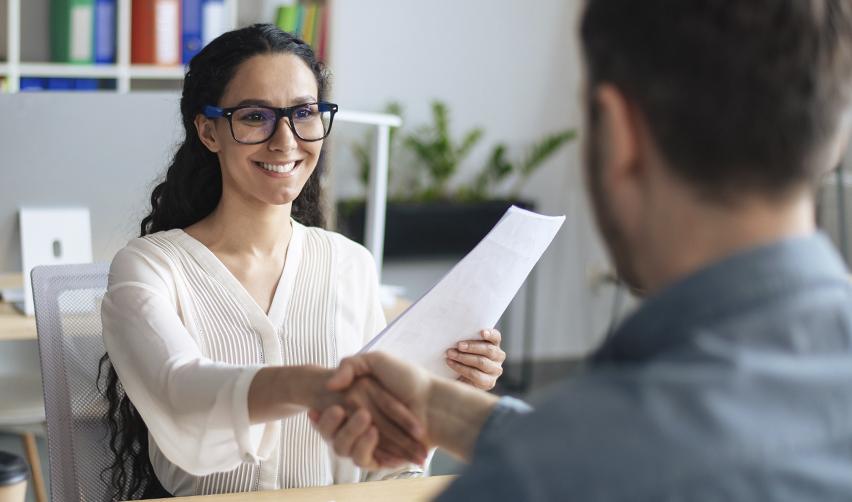 An investor meeting with an EB5 advisor, highlighting professional guidance in choosing a TEA-qualified investment project.