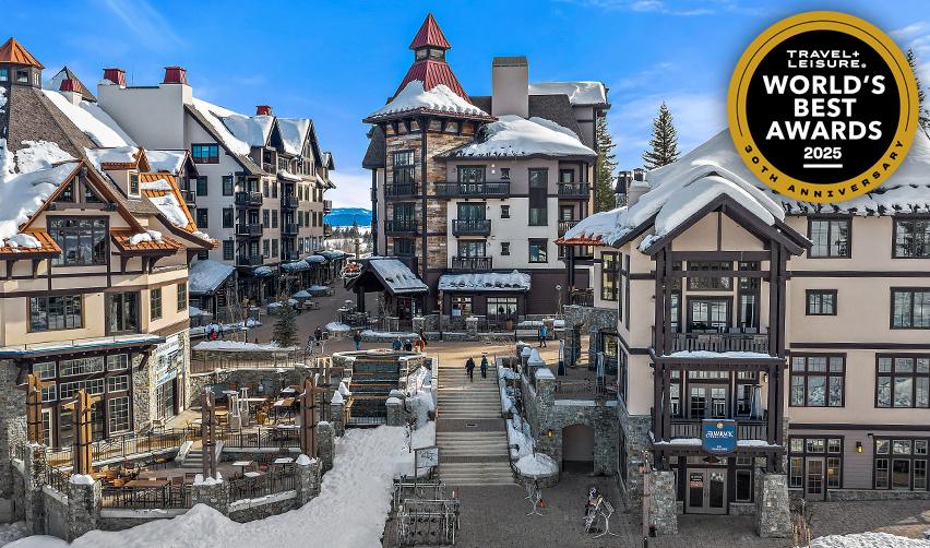 A group of buildings with snow on the roof