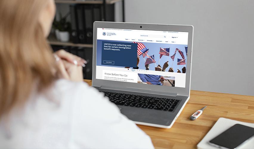 Prospective EB5 investor checking USCIS updates and immigration rules online.