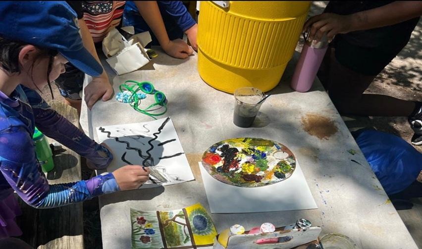 Children engaging in arts & crafts activities at Bay Creek.