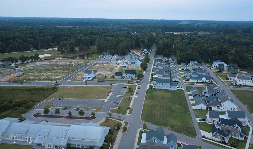 Aerial view of Bay Creek residential neighborhoods with completed homes, streets, and community amenities as part of the EB5 development.