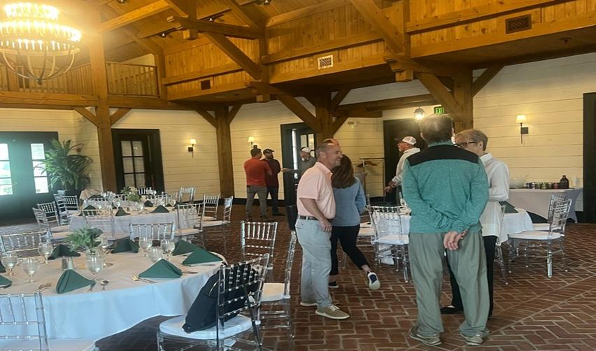 Residents gathered inside Bay Creek’s Tavern with decorated tables set for dinner, reflecting community events and social life at the resort.