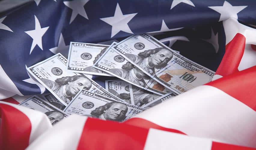 U.S. hundred-dollar bills surrounded by the American flag, representing EB5 investment funds supporting economic growth and U.S. residency opportunities.
