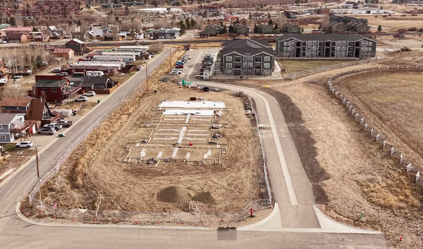 A construction site with a lot of dirt and buildings