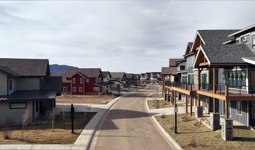 Street view of newly built homes in Grand Park, Fraser, Colorado, showcasing active construction progress within the rural EB5 development.