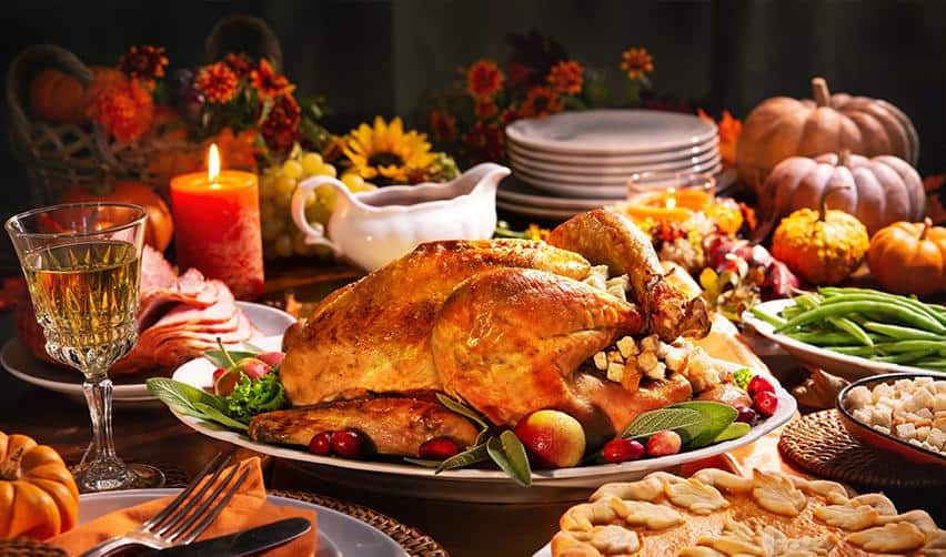 Traditional Thanksgiving dinner table with turkey, vegetables, and seasonal décor, highlighting the sense of gratitude and new beginnings many EB5 investors experience after starting their U.S. residency journey.