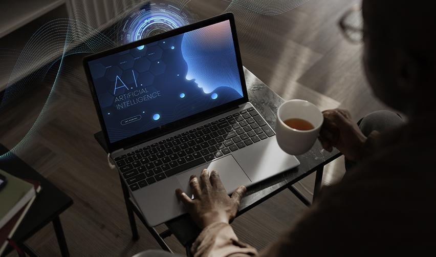 A person reviewing an artificial intelligence interface on a laptop, representing EB5 investors using AI platforms to research developers, analyze data, and confirm project details.