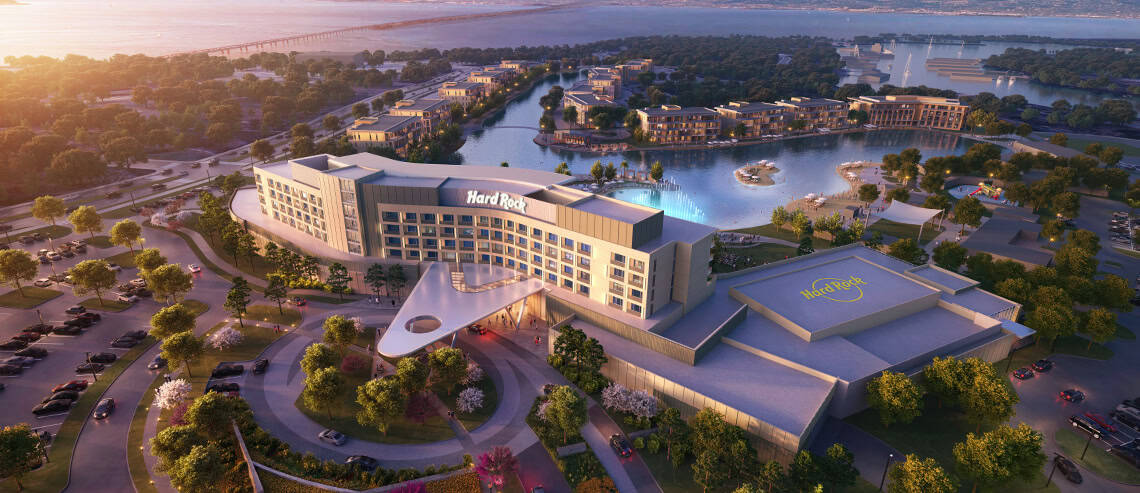 A large building with a river in the background
